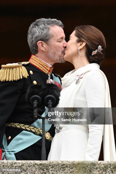 Danish King Frederik X and wife Queen Mary of Denmark kiss after their proclamation by the Prime Minister, Mette Frederiksen on the balcony of...