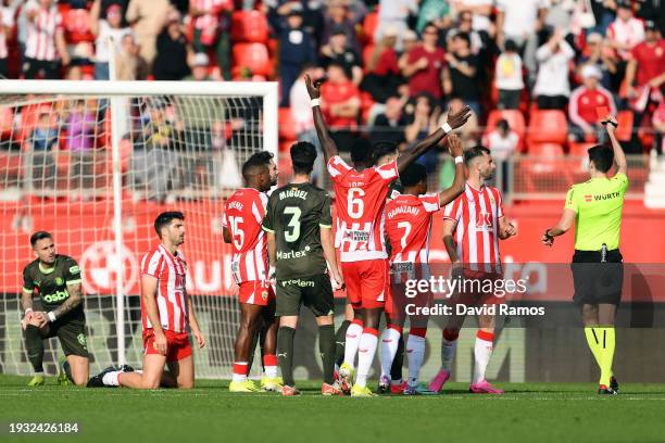 Artem Dovbyk of Girona FC recieves a red card from referee Mateo Busquets Ferrer, during the LaLiga EA Sports match between UD Almeria and Girona FC...