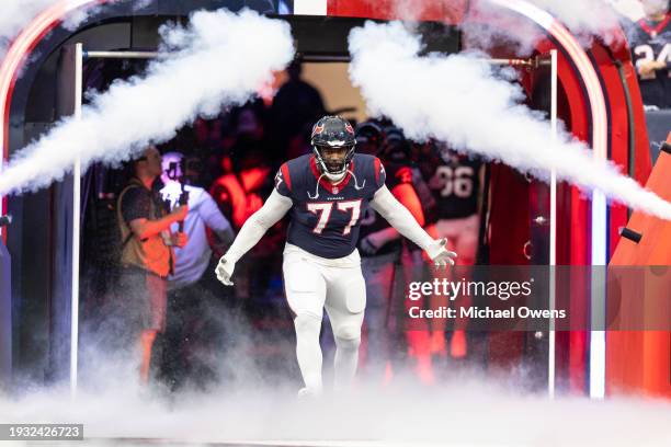 George Fant of the Houston Texans reacts as he takes the field prior to an NFL wild-card playoff football game between the Houston Texans and the...