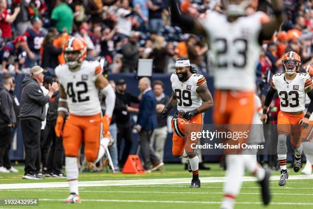 Za'Darius Smith of the Cleveland Browns reacts as he takes the field prior to an NFL wild-card playoff football game between the Houston Texans and...