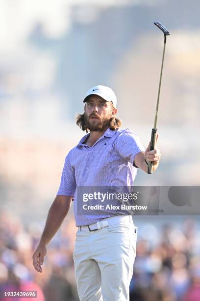 Tommy Fleetwood of England celebrates on the 18th green after winning the Dubai Invitational at Dubai Creek Golf and Yacht Club on January 14, 2024...