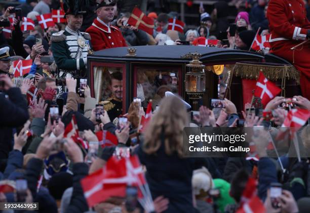 Danish King Frederik X waves as he rides in a carriage following his proclamation as king on January 14, 2024 in Copenhagen, Denmark. King Frederik X...