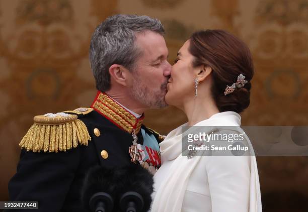 Danish King Frederik X and Queen Mary kiss on the balcony of Christiansborg Palace shortly after his proclamation on January 14, 2024 in Copenhagen,...