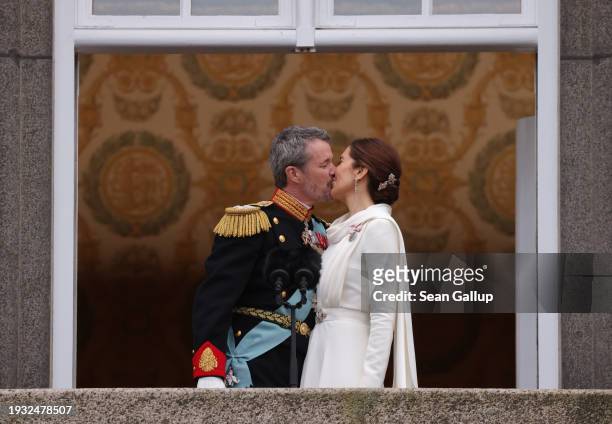 Danish King Frederik X and Queen Mary kiss on the balcony of Christiansborg Palace shortly after his proclamation on January 14, 2024 in Copenhagen,...
