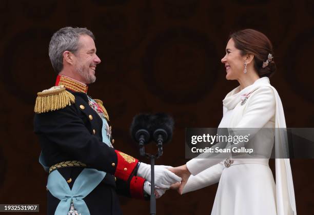 Danish King Frederik X and Queen Mary gaze at each other on the balcony of Christiansborg Palace shortly after his proclamation on January 14, 2024...