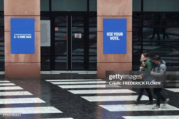 People walk past posters announcing the upcoming European elections, at the European Parliament on January 17, 2024 in Strasbourg, eastern France.