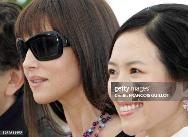 Members of the Jury of the 59th edition of the Cannes Film Festival Italian actress Monica Bellucci Chinese actress Zhang Ziyi pose during a...