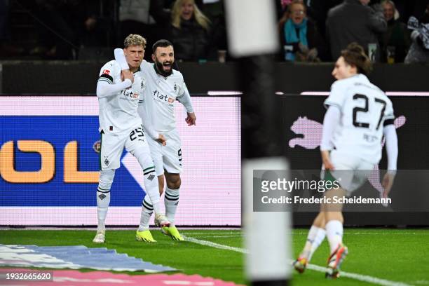 Robin Hack of Borussia Moenchengladbach celebrates with team mate Franck Honorat after scoring their team's first goal during the Bundesliga match...