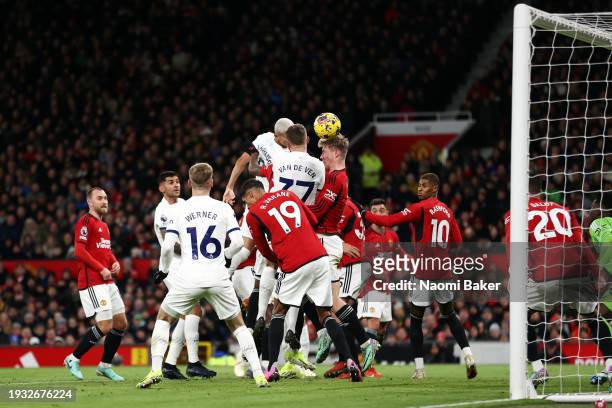Richarlison of Tottenham Hotspur scores their team's first goal during the Premier League match between Manchester United and Tottenham Hotspur at...