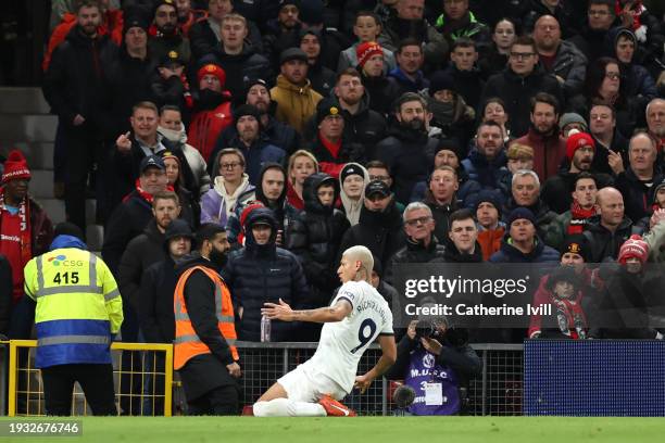 Richarlison of Tottenham Hotspur celebrates after scoring their team's first goal during the Premier League match between Manchester United and...