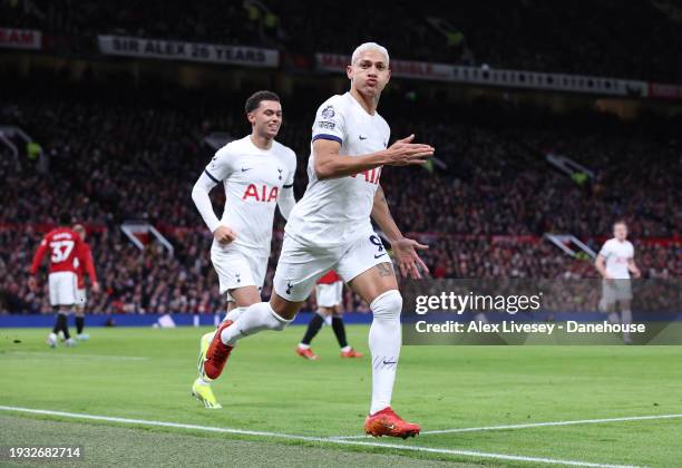 Richarlison of Tottenham Hotspur celebrates after scoring their first goal during the Premier League match between Manchester United and Tottenham...