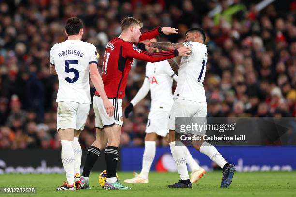 Rasmus Hojlund of Manchester United clashes with Cristian Romero of Tottenham Hotspur during the Premier League match between Manchester United and...