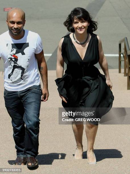 Academy award winning French actress Juliette Binoche arrives with Akram Khan for a photo-call on the steps of the Sydney Opera House on February 16,...