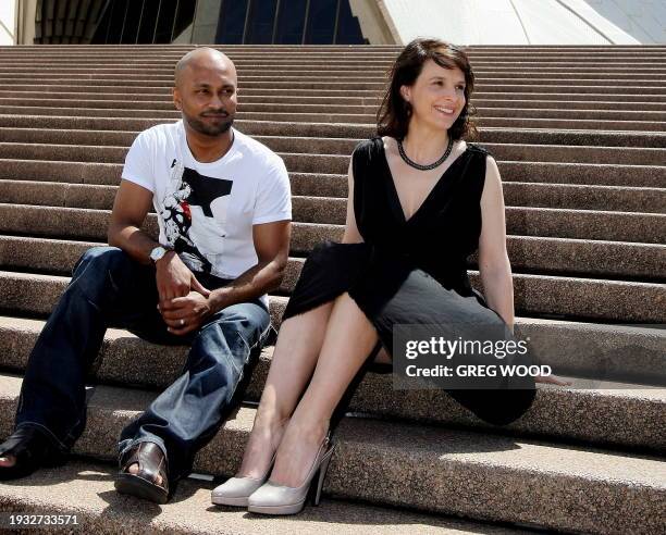 Academy award winning French actress Juliette Binoche poses with Akram Khan on the steps of the Sydney Opera House during a photo-call on February...