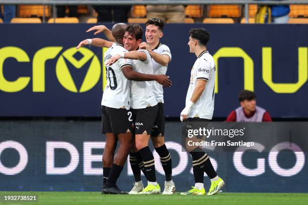 Jesus Vazquez of Valencia CF celebrates with teammates after scoring their team's fourth goal during the LaLiga EA Sports match between Cadiz CF and...