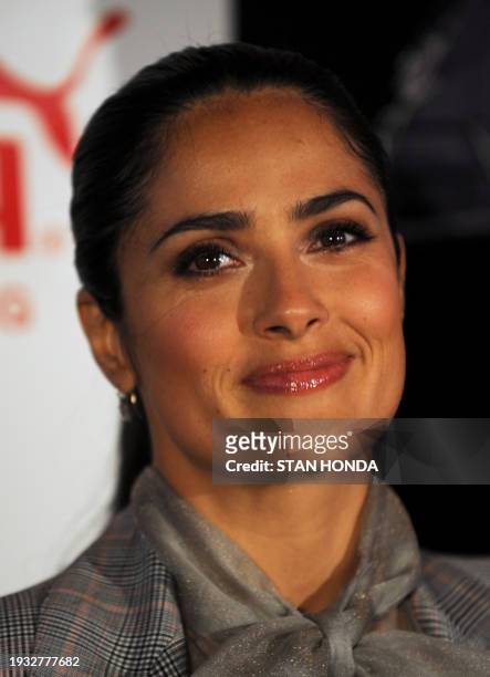 Mexican actress Salma Hayek smiles after christening Puma's "Il Mostro" boat on May 12, 2008 in Boston harbor. Puma unveiled the new Open 70's boat...
