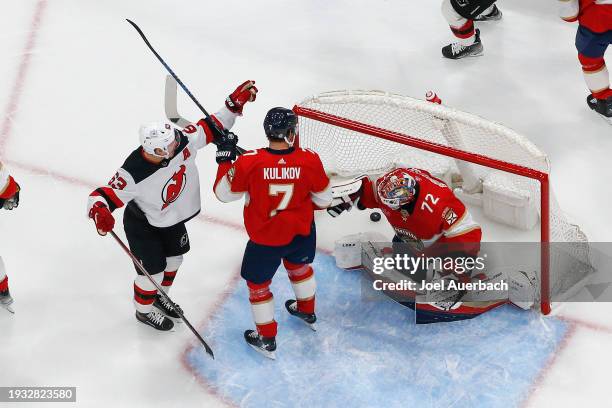 Jesper Bratt celebrates after Michael McLeod of the New Jersey Devils scores a first period goal past goaltender Sergei Bobrovsky of the Florida...