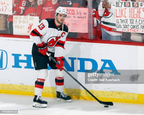 Nico Hischier of the New Jersey Devils skates with the puck prior to the game against the Florida Panthers at the Amerant Bank Arena on January 13,...