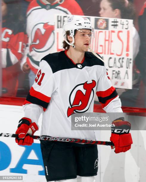 Dawson Mercer of the New Jersey Devils skates prior to the game against the Florida Panthers at the Amerant Bank Arena on January 13, 2024 in...