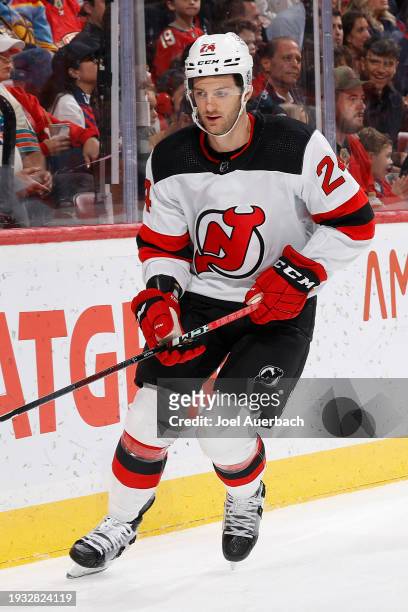 Colin Miller of the New Jersey Devils skates against the Florida Panthers at the Amerant Bank Arena on January 13, 2024 in Sunrise, Florida.
