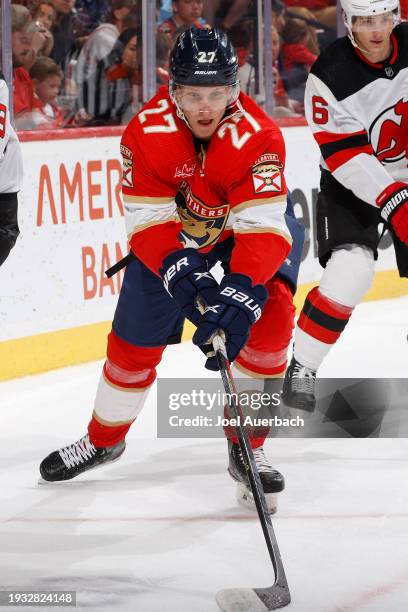 Eetu Luostarinen of the Florida Panthers skates with the puck against the New Jersey Devils at the Amerant Bank Arena on January 13, 2024 in Sunrise,...