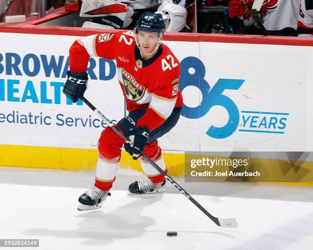 Gustav Forsling of the Florida Panthers skates with the puck against the New Jersey Devils at the Amerant Bank Arena on January 13, 2024 in Sunrise,...