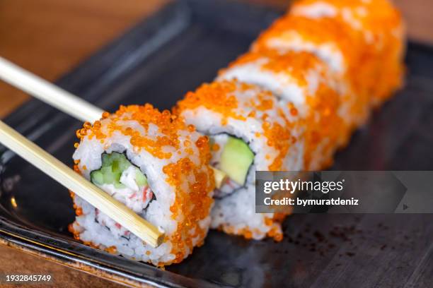 sushi rolls with salmon, cheese, caviar - inside out sushi roll stock pictures, royalty-free photos & images