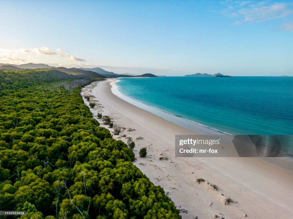 Beautiful high angle aerial drone view of famous Whitehaven Beach, part of the Whitsunday Islands National Park near the Great Barrier Reef, Queensland, Australia. Popular tourist destination.