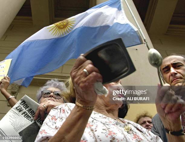 Protesters are calling for their savings to be returned to them after they have been without since they were frozen in December 2001 by then economy...