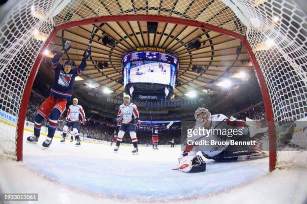 Artemi Panarin of the New York Rangers celebrates a first period goal by Alexis Lafreniere against Charlie Lindgren of the Washington Capitals at...