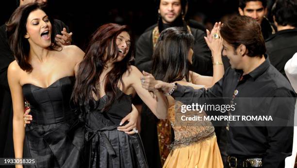 Indian actress Sushmita Sen and actor Salman Khan present creations by Indian designer Sanjana Jon during the Wills India Fashion Week Spring Summer...