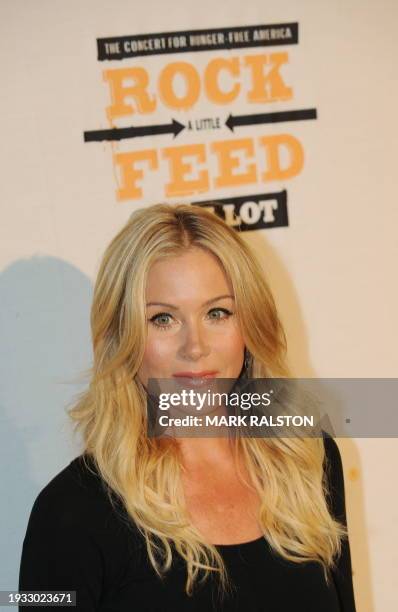 Actress Christina Applegate poses on the red carpet as she arrives for the "Rock a Little, Feed a Lot" concert at the Nokia Theater in Los Angeles on...