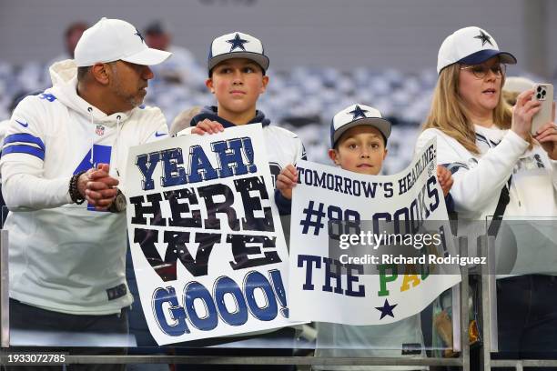 Fans of the Dallas Cowboys watch warmups prior to the NFC Wild Card Playoff game against the Green Bay Packers at AT&T Stadium on January 14, 2024 in...