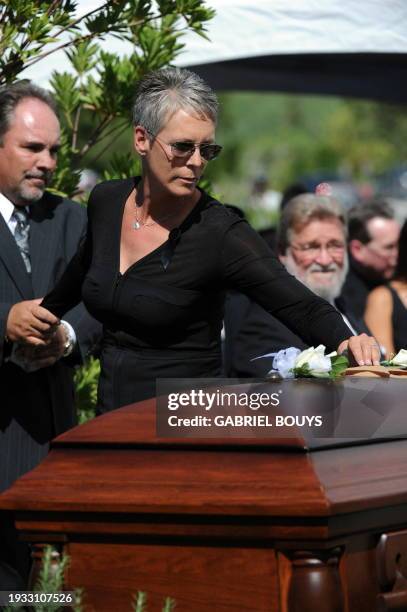 Actress Jamie Lee Curtis places a flower on the casket of her father Hollywood legend Tony Curtis at the Palm Mortuary and Cemetery, Green Valley in...