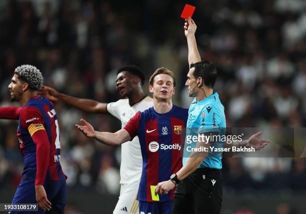 Ronald Araujo of FC Barcelona is shown a red card by Referee Juan Martinez during the Super Copa de España Final match between Real Madrid and FC...