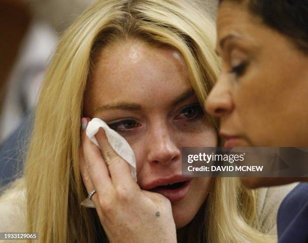 Lindsay Lohan cries next to her lawyer Shawn Chapman Holley as she is sentanced to 90 days jail by Judge Marsha Revel during her hearing at the...