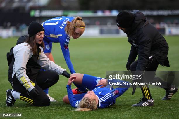 Lena Petermann of Leicester City is treated for an injury as Janice Cayman looks on during the Adobe Women's FA Cup Fourth Round between Derby County...