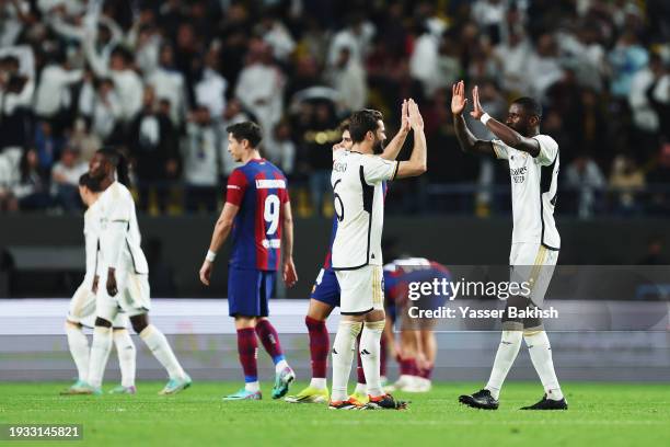 Nacho Fernandez and Antonio Ruediger of Real Madrid celebrate after the team's victory in the Super Copa de España Final match between Real Madrid...
