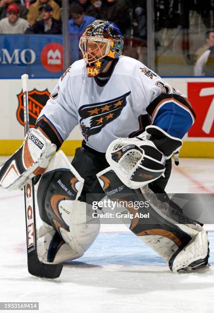 Olaf Kolzig of the Washington Capitals skates against the Toronto Maple Leafs during NHL game action on October 25, 2003 at Air Canada Centre in...