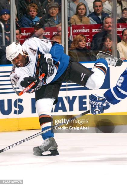 Mike Grier of the Washington Capitals skates against the Toronto Maple Leafs during NHL game action on October 25, 2003 at Air Canada Centre in...