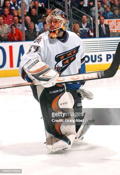 Olaf Kolzig of the Washington Capitals skates against the Toronto Maple Leafs during NHL game action on October 25, 2003 at Air Canada Centre in...