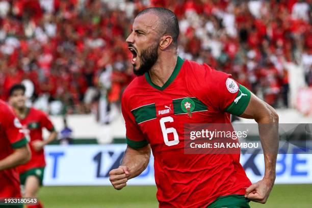 Morocco's defender Romain Saiss celebrates after scoring his team's first goal during the Africa Cup of Nations 2024 group F football match between...