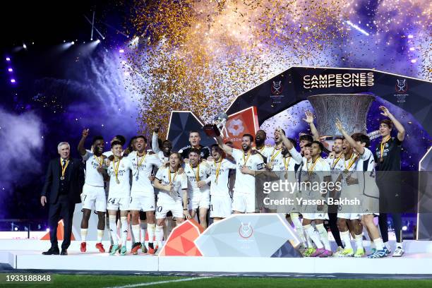 Nacho Fernandez of Real Madrid lifts the Super Copa de España trophy after the team's victory in the Super Copa de España Final match between Real...