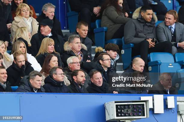 Gareth Southgate, Manager of England and Steve Holland, Assistant Coach of England watch from the stand during the Premier League match between...