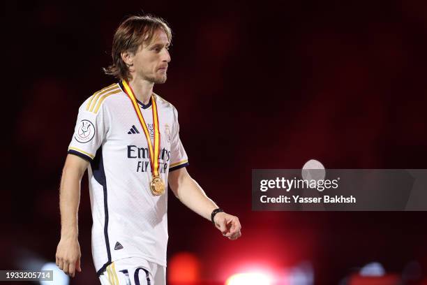 Luka Modric of Real Madrid looks on with his winners medal after the team's victory in the Super Copa de España Final match between Real Madrid and...
