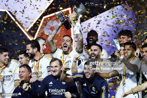 Joselu of Real Madrid celebrates with the Super Copa de España trophy after the team's victory in the Super Copa de España Final match between Real...