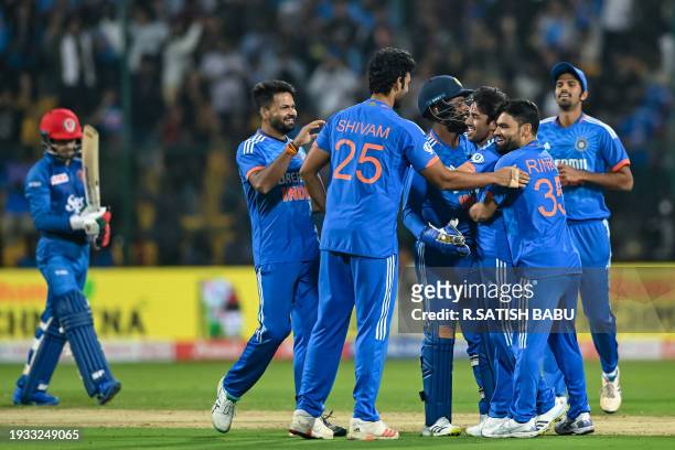 India's players celebrate after winning the second super over of third and final Twenty20 international cricket match between India and Afghanistan...