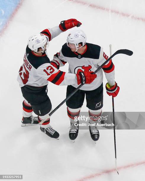 Nico Hischier John Marino of the New Jersey Devils after he scored an open net goal against the Florida Panthers at the Amerant Bank Arena on January...