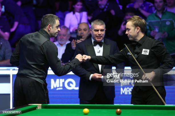 Ronnie O’Sullivan of England and Ali Carter of England shake hands after the Final match between Ronnie O’Sullivan of England and Ali Carter of...