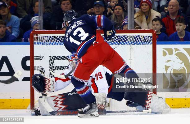 Alexis Lafreniere of the New York Rangers cores a first period goal against Charlie Lindgren of the Washington Capitals at Madison Square Garden on...